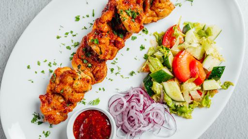 An overhead shot of a delicious meal with meat and salad