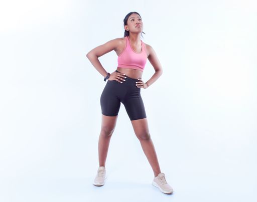 A black female working out on a white background