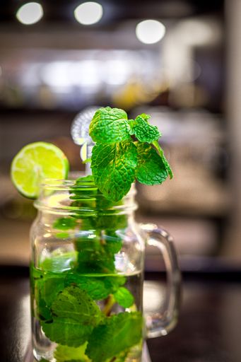 A vertical shot of a bank of mojitos