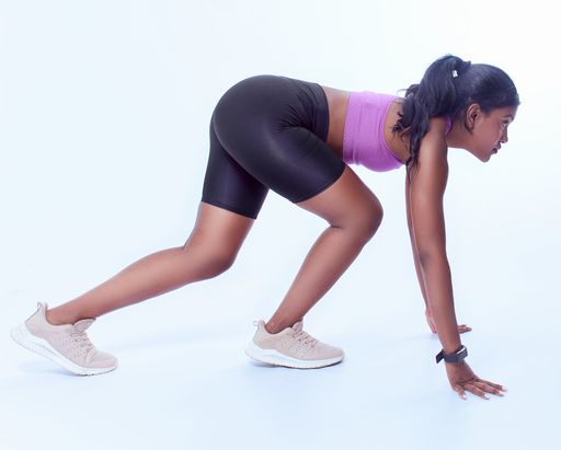 A black female working out on a white background