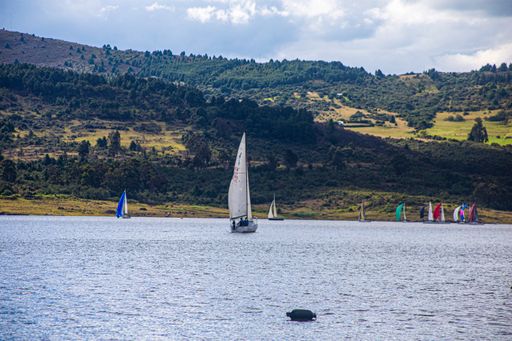 A beautiful shot for a cool day view at the small boat sailing in lake in Guatavita, Colombia