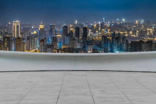empty marble ground floor with modern cityscape at night. for car  copy space .