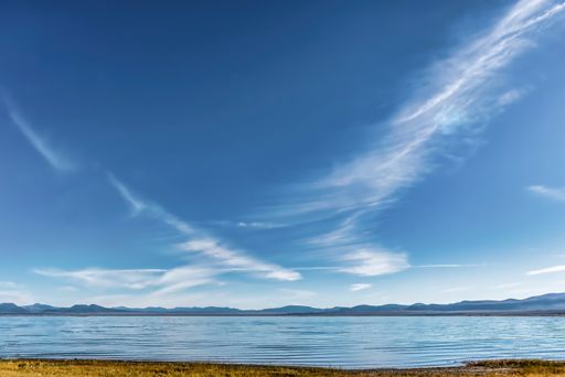 A beautiful shot of a Mono Lake in California, USA with a blue sky in the background
