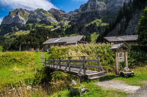 A small wooden bridge over a river in Barmaz, Valais, Switzerland