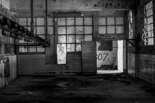 A grayscale of an old meat factory in Serbia