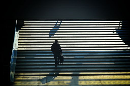 A high angle view of a human silhouette exiting from the underpass