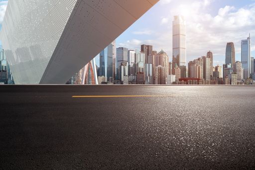 empty concrete ground floor with modern cityscape.