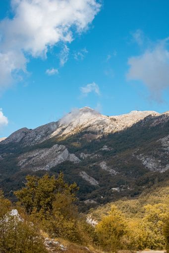 An aerial view of rocky hills under the blue sky