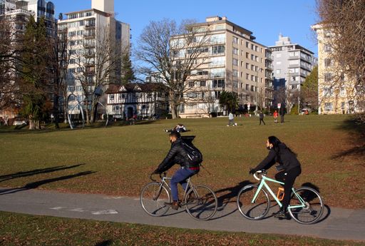Many people riding bikes on the streets of Vancouver, Canada