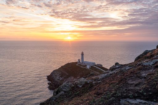 The South Stack Lighthouse during a beautiful sunset in Wales, the UK