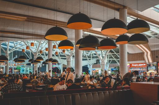 The people have lunch in the food court of a shopping center in Istanbul, Turkey