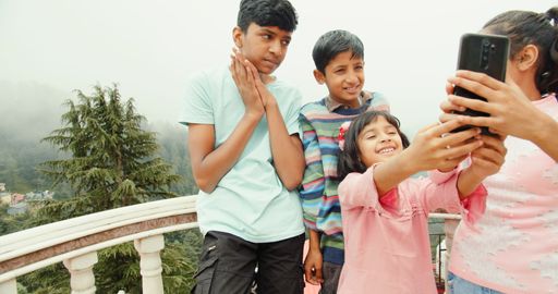 The South Asian children from India taking selfies on phone in Shimla, Himachal Pradesh