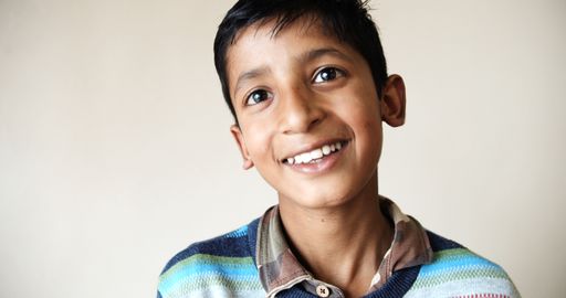 A portrait of a South Asian boy from India