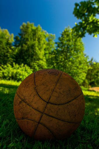 A vertical shot of a basketball ball