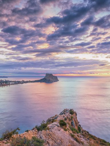 A vertical shot of Mirador Monte Toix in Calp, Alicante, Valencia, Spain during sunset