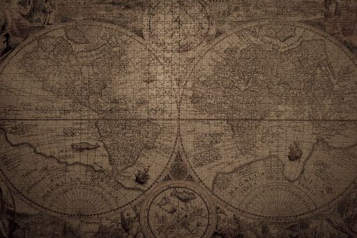 A closeup shot of a vintage world map made with puzzles