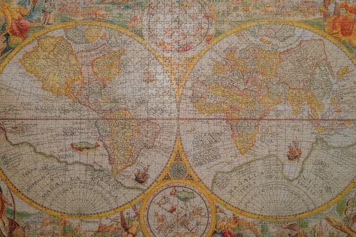 A closeup shot of a vintage world map made with puzzles