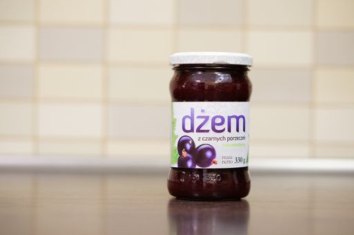 A beautiful shot of Polish Dzem black currant marmalade in a glass jar in Poznan, Poland