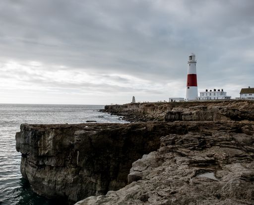 A wide angle shot of the Portland Bill Lighthouse in the UK