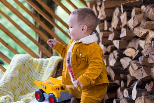 A caucasian baby boy in outdoors