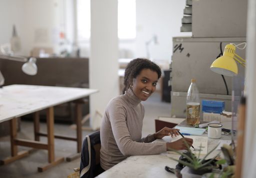 A young African-American female working from home because of the global pandemic