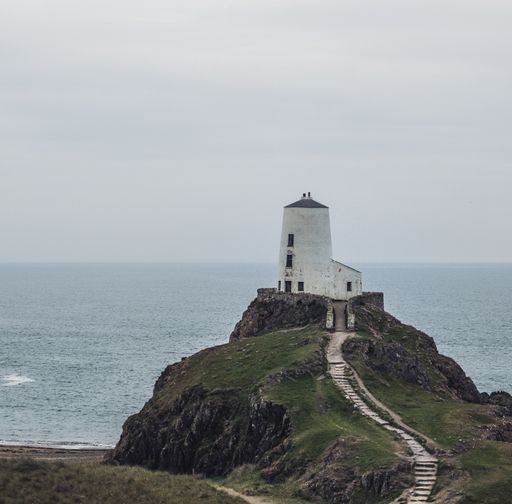 A shot of the lighthouse on the cliff  in Ynys Llanddwyn, Anglesey, Wales