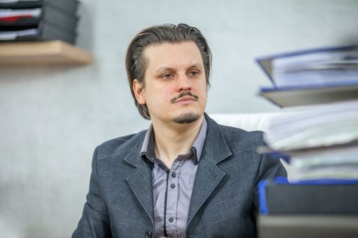 A young businessman working from his office  - the concept of hard work