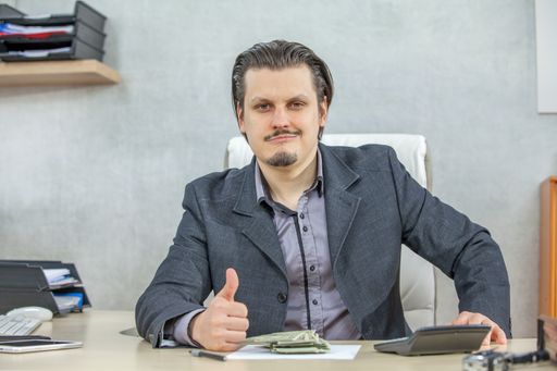 A young businessman working from his office - the concept of confidence