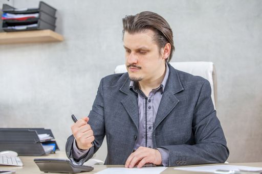 A young businessman working from his office - the concept of hard work