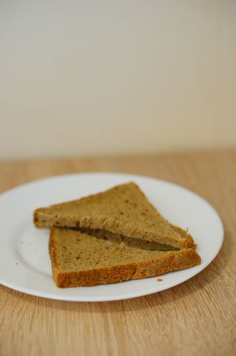 Two pieces of bread on the plate
