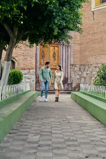 Young latin male and female couple looking at each other in love between 25 and 35 years old