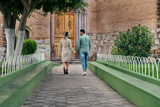 Young latin male and female couple looking at each other in love between 25 and 35 years old