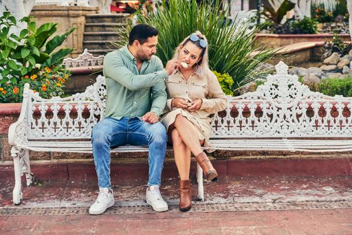 Young Latino male and female couple looking at each other in love between 25 and 35 years old