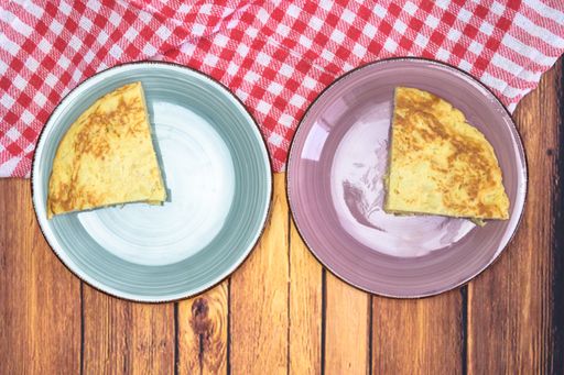 A tasty cake with an egg yolk on a wooden table