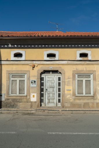 A vertical shot of the facade of a traditional portuguese house