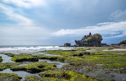 The cloudy blue sky over the sea captured from the coast in Bali, Indonesia