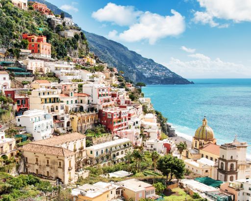 A high angle shot of the beautiful buildings by the Amalfi Coast captured in Italy