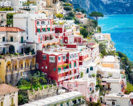 A high angle shot of the beautiful buildings by the Amalfi Coast captured in Italy