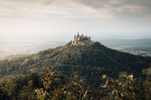 A beautiful view of the Hohenzollern Castle under the cloudy sky in Germanyv