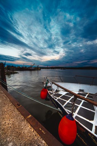 A vertical shot of the port aquatory and a dock at sunset. Klaipeda, Lithuania