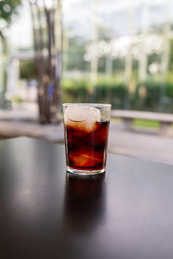 A refreshing drink with ice cubes on a table