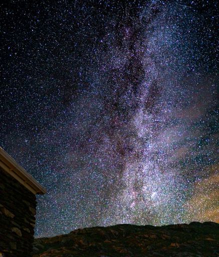 A beautiful starry glowing sky at night in the countryside - perfect for wallpapers
