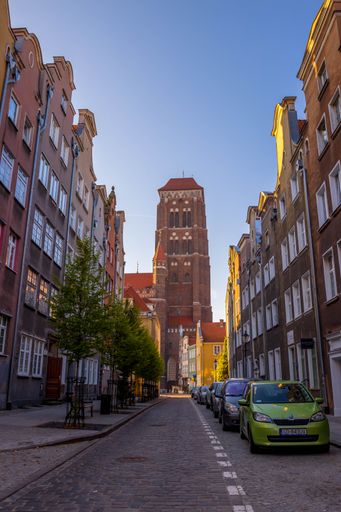 A vertical shot of Basilica of St. Mary against a clear blue sky in the old town of Gdansk in Poland