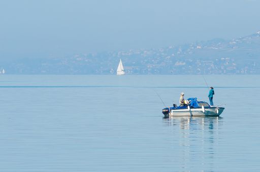 An amazing view of a boat and fishermen standing on it
