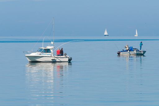 An amazing view of boast and fishermen standing on them