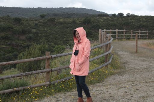 A smiling Hispanic female hiking in the national park Monfrague
