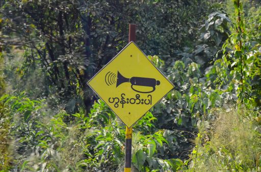 A closeup shot of a warning sign in the forest, forest, Myanmar