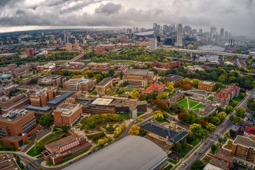An aerial view of dense buildings and a large public University in Minneapolis, Minnesota