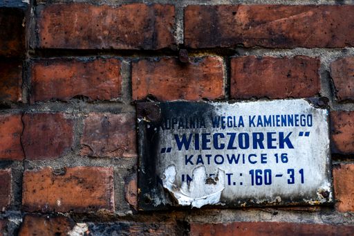 Worn Old Wieczorek Sign on Red Brick Wall Nikiszowiec in Katowice, Poland