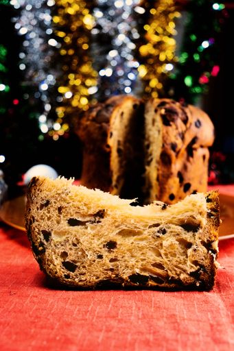 A vertical shot of panettone with dried fruit traditional Italian Christmas cake